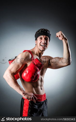 Muscular boxer wiith red gloves