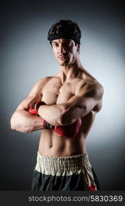 Muscular boxer wiith red gloves