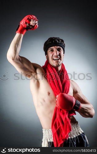 Muscular boxer wiith red gloves