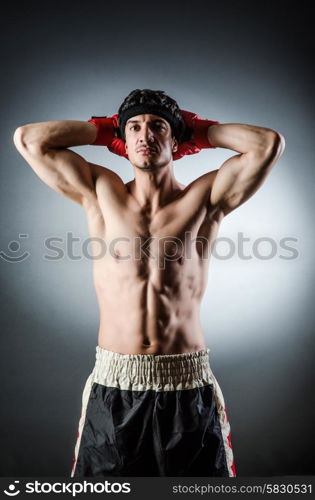 Muscular boxer wiith red gloves