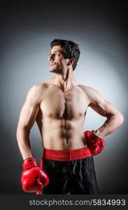 Muscular boxer wiith red gloves