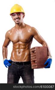 Muscular builder with bricks on white