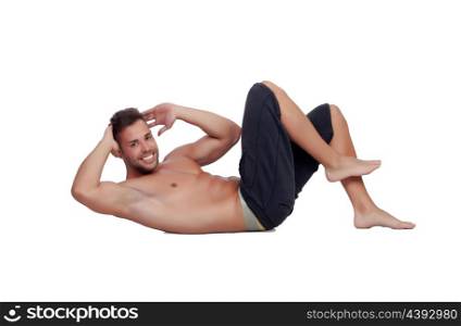 Muscular man doing abdominals isolated on a white background