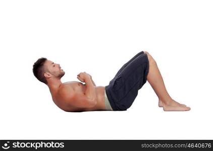 Muscular man doing abdominals isolated on a white background