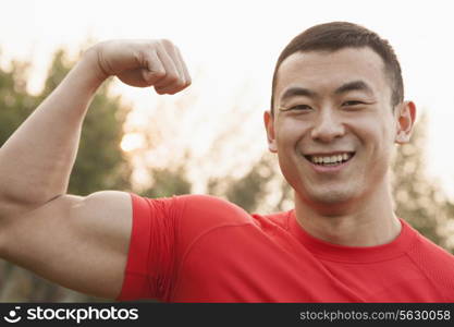 Muscular Man Flexing Bicep