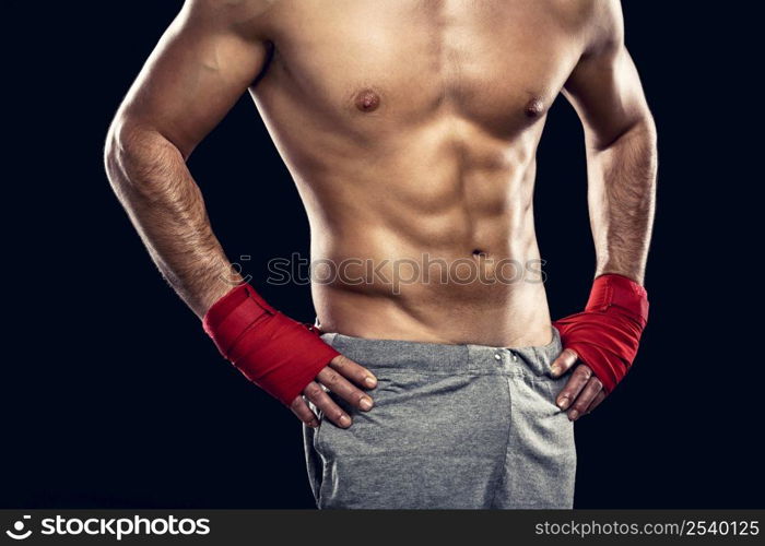 Muscular man, isolated over a gray background