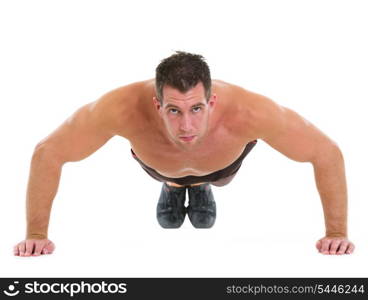 Muscular man making push up exercises