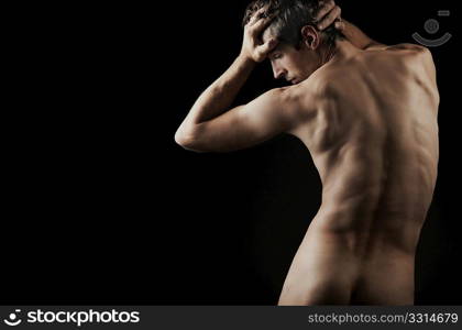 muscular man posing artistic