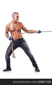 Muscular man pulling the rope