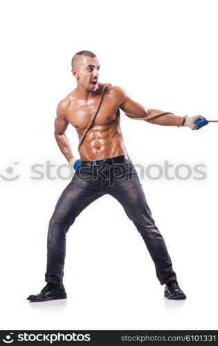 Muscular man pulling the rope