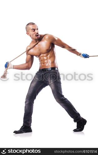 Muscular man pulling the rope