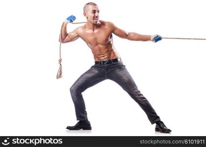 Muscular man pulling the rope