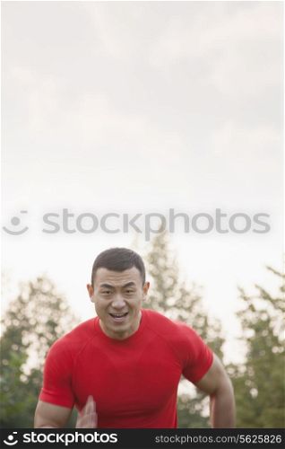 Muscular Man Running Toward Camera