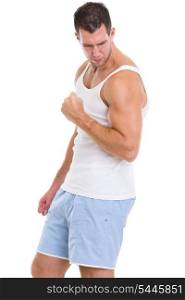 Muscular man showing biceps