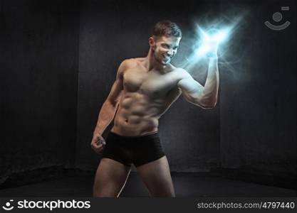 Muscular man squeezing the power