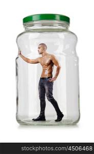 Muscular ripped man in glass jar