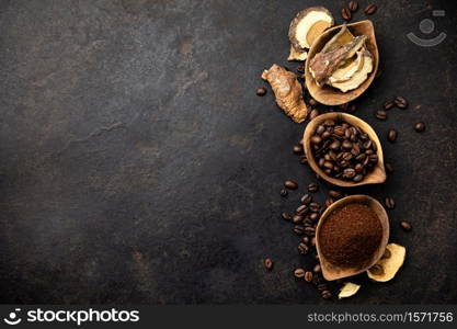 Mushroom Chaga Coffee Superfood Trend-dry and fresh mushrooms and coffee beans on dark background. Copy space, top view. Concept of trend modern food industry.