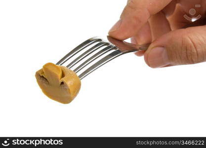 mushroom on a fork isolated on white background