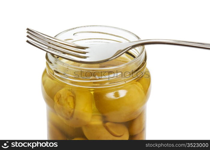 mushroom on a fork isolated on white background