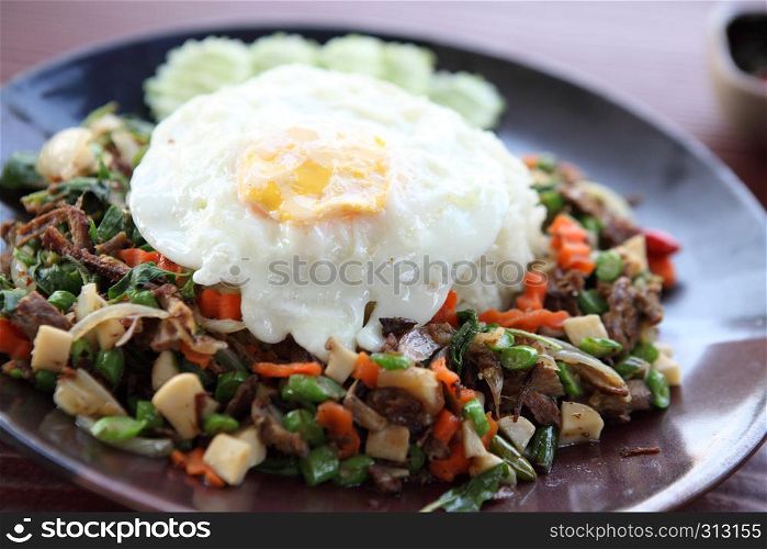 mushroom with basil and egg served with rice