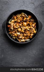 Mushrooms fried with onion, top view
