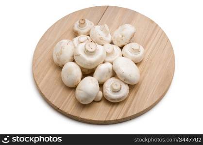 mushrooms on a cutting board isolated on white background