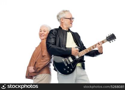 music, age and people concept - happy senior couple with electric guitar. happy senior couple with electric guitar