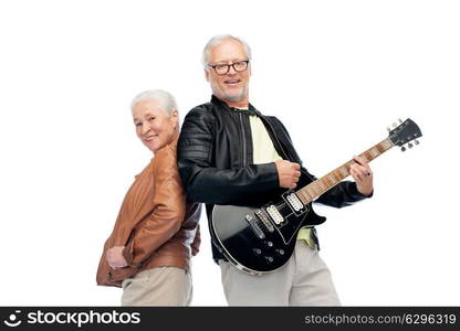 music, age and people concept - happy senior couple with electric guitar. happy senior couple with electric guitar