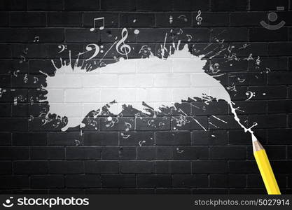 Music and drawing. Music notes and pencil on black background