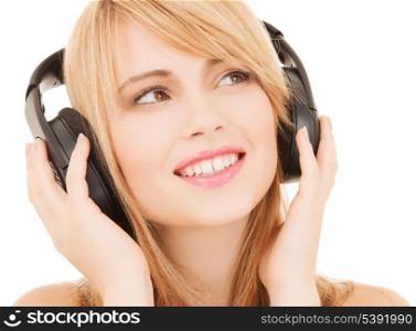 music and entertainment concept - happy girl with headphones