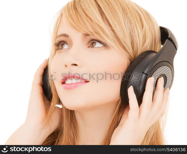 music and entertainment concept - happy girl with headphones