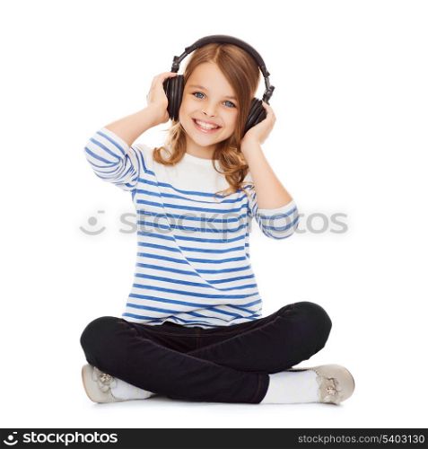 music and technology concept - child with headphones