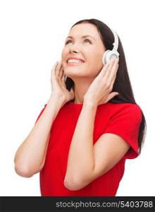 music and technology concept - smiling young woman with headphones