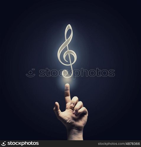 Music concept icon. Male hand choosing music note symbol from media icons