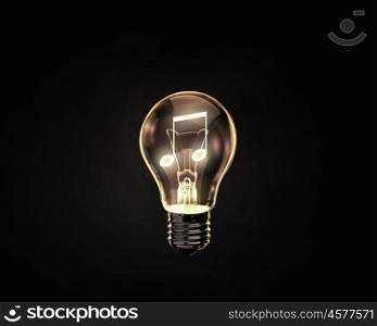 Music concept. Light bulb with music note inside on dark background