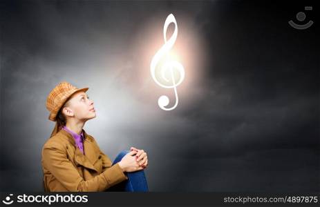 Music concept. Young pretty woman and sign of music clef