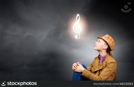 Music concept. Young pretty woman and sign of music clef