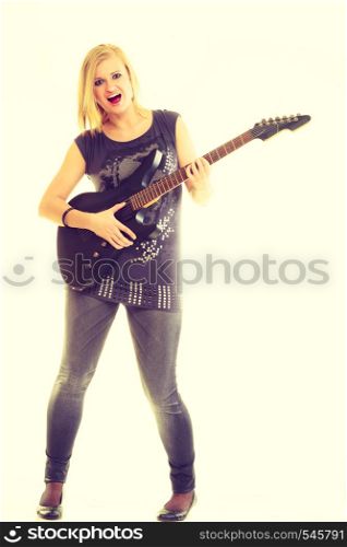 Music concert and show. Blonde pretty woman artist playing rock roll on electrical guitar. Young girl feels like star. Star beginner creating sounds song.. Woman artist player with electric guitar.