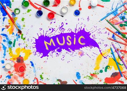 Music creative ideas. Music concept with paint spalshes on white paper