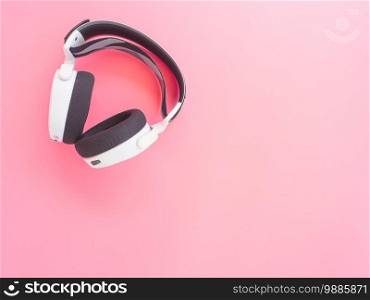 music headphones on pink background.