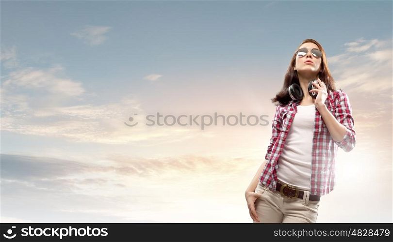 Music lover. Young pretty girl in casual with headphones listen to music