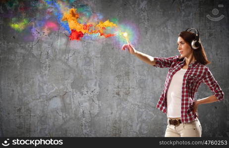 Music lover. Young pretty woman in casual wearing headphones