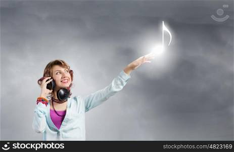 Music lover. Young pretty woman in casual wearing headphones