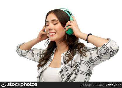 music, technology and people concept - happy young woman or teenage girl with headphones. happy young woman or teenage girl with headphones