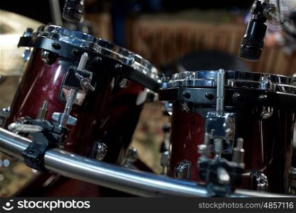 musical instruments and entertainment concept - drums at music studio. drums at music studio