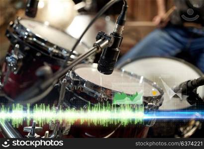 musical instruments and sound concept - drum kit and microphone at music studio. drum kit and microphone at music studio