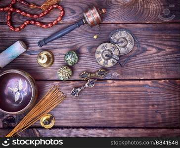 Musical religious instruments for Buddhist practices and meditations, brown wood background