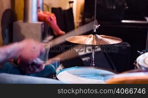 Musician playing drums on stage
