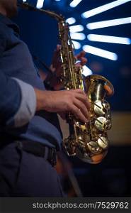 musician with saxophone performs at a concert
