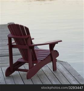 Muskoka chair on dock at Lake of the Woods, Ontario